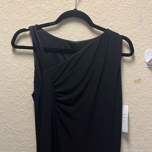New with tags. Dress has a slit